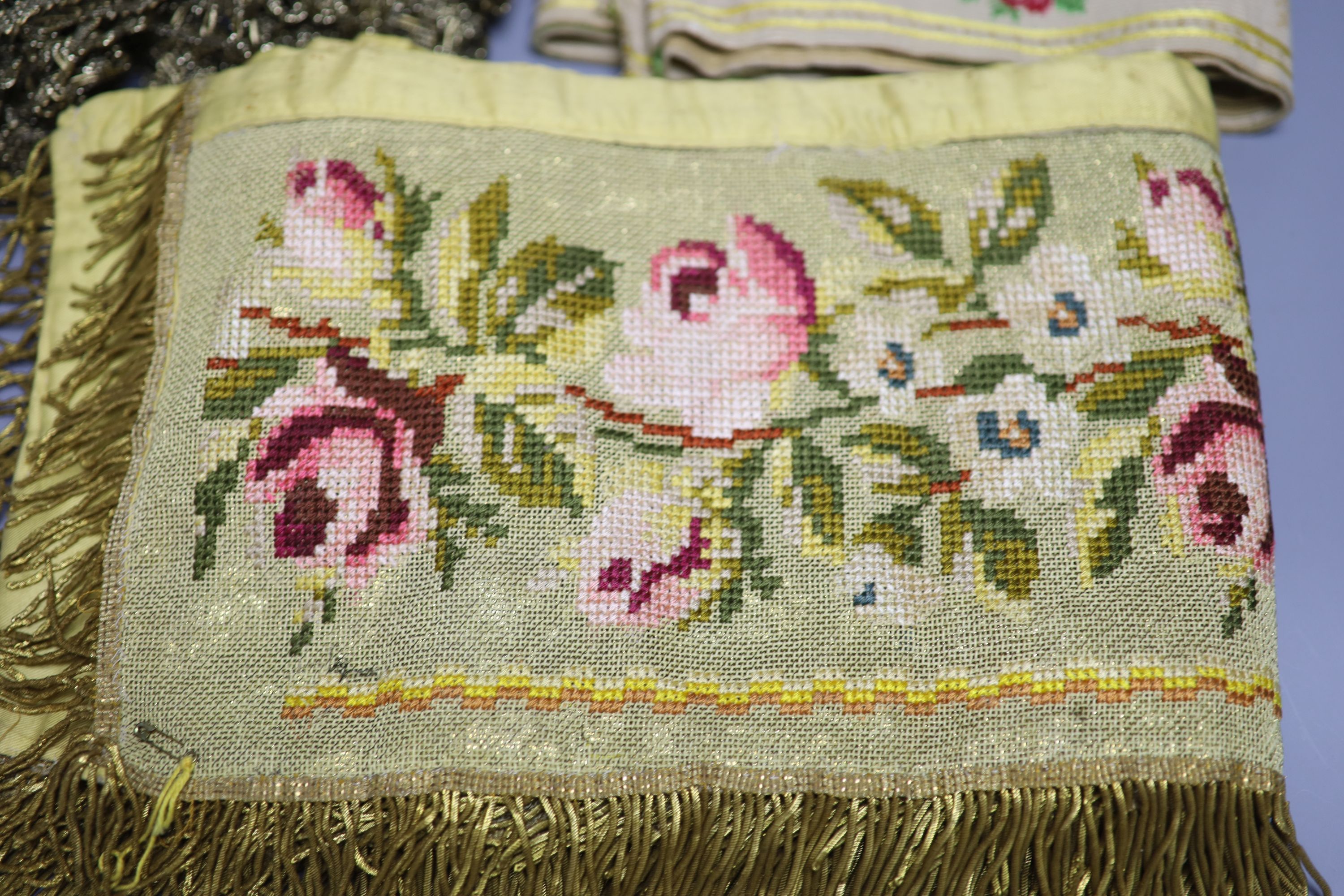 A Lurex 19th century cross stitch pelmet with gold coloured metal bullion fringing, a long French floral braid and a quantity of gold c